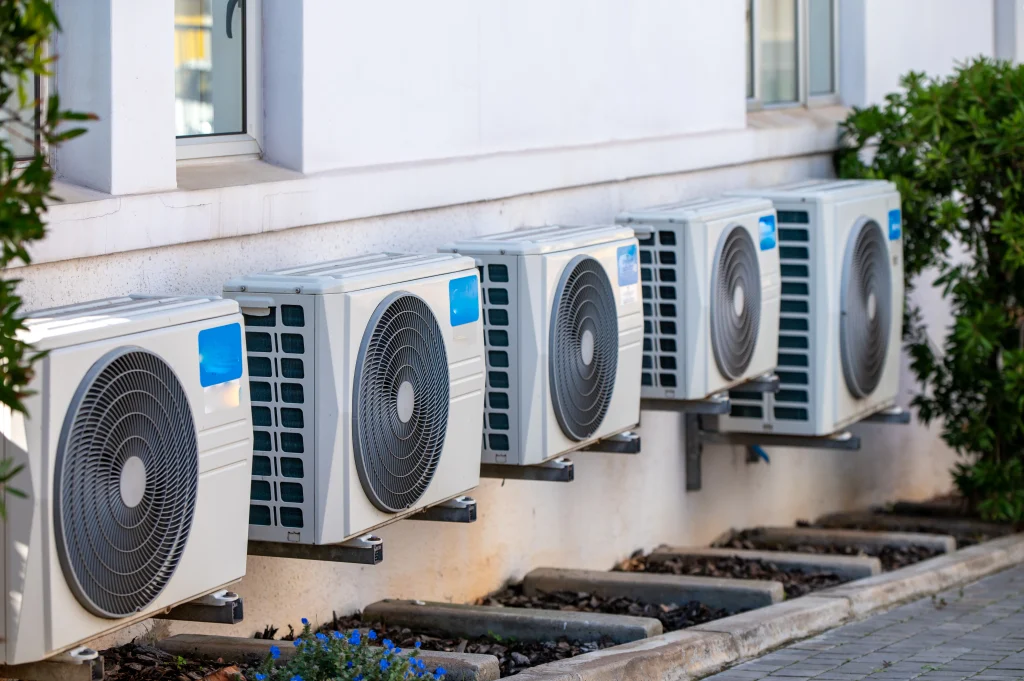 Commercial air conditioning installation with multiple outdoor AC units fitted to a business premises