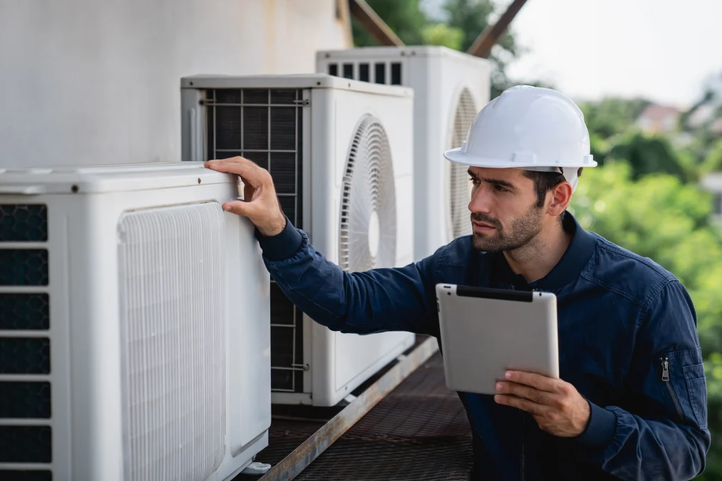 commercial air conditioning technician reviewing ac repair works